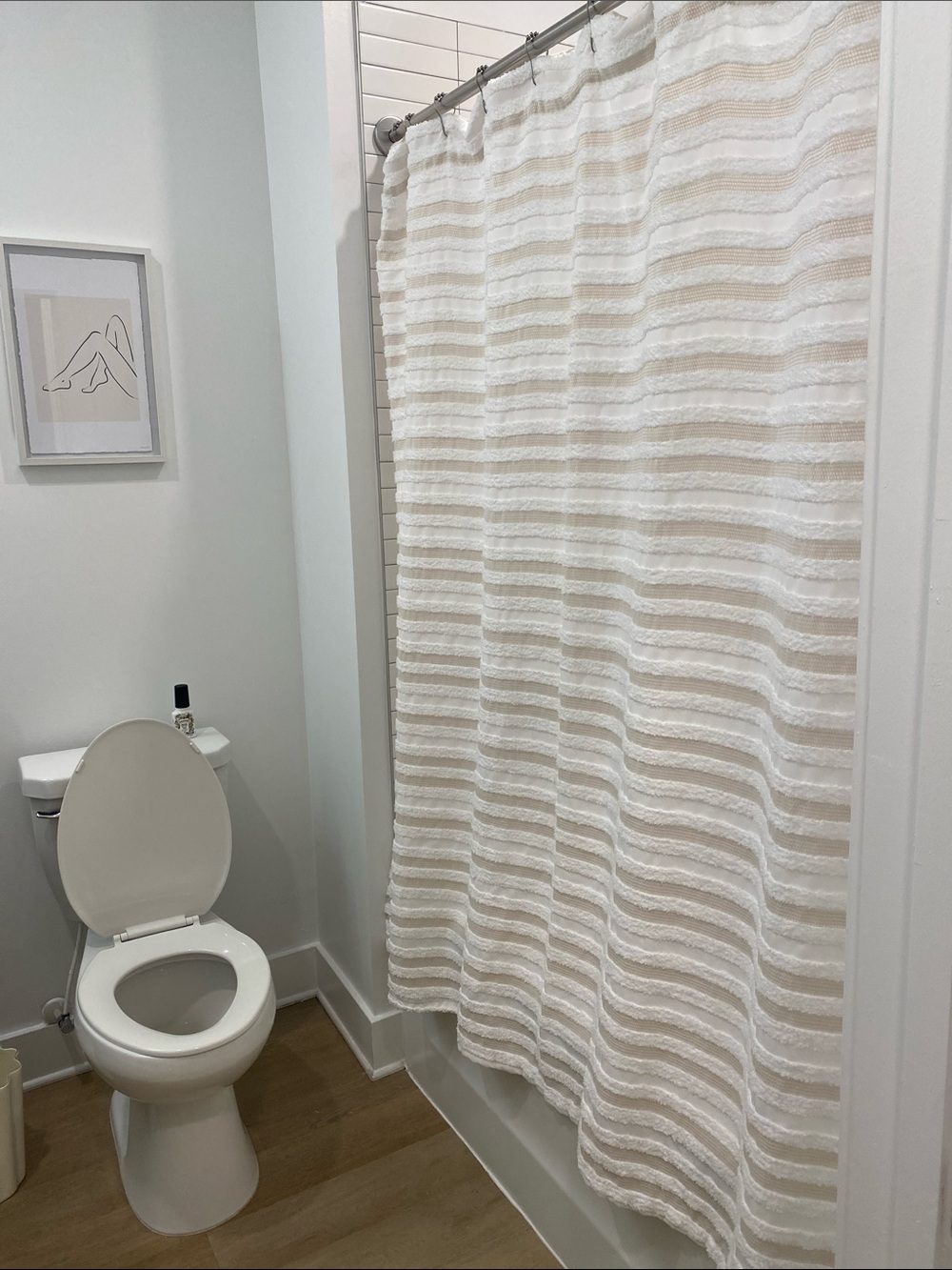 Cream and white striped shower curtain